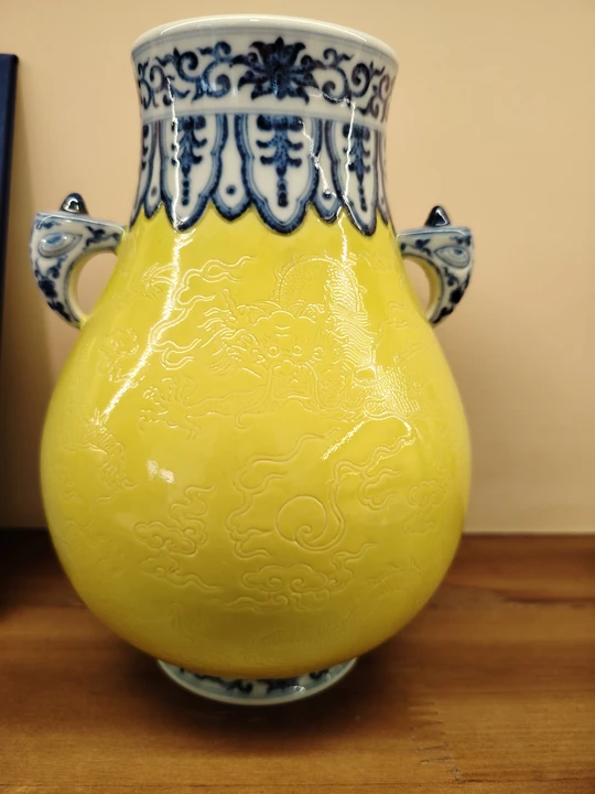 Qing Dynasty Emperor Qianlong Blue-and-White Borders Top and Bottom, Poured Yellow Glaze with Incised Dragon Design Double-Handle Zun Vase