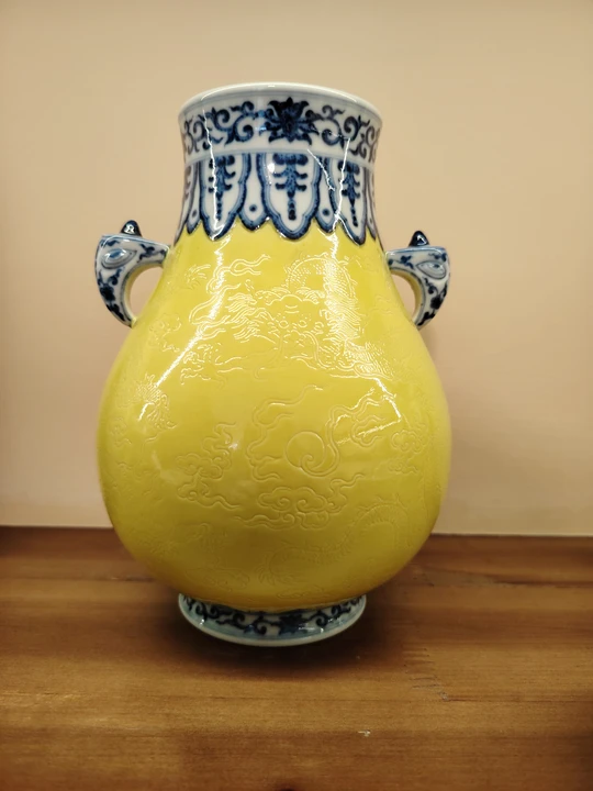 Qing Dynasty Emperor Qianlong Blue-and-White Borders Top and Bottom, Poured Yellow Glaze with Incised Dragon Design Double-Handle Zun Vase