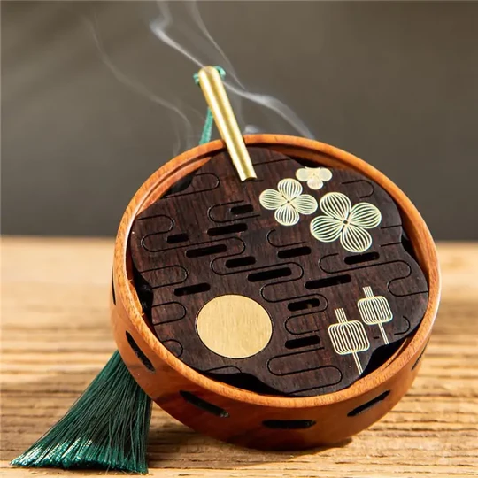 Close-Up Of Brass Inlay And Tassel Detail On Chinese Fan Incense Burner