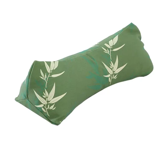 Green bamboo print buckwheat hull triangular cervical pillow front view. Buckwheat hull triangular cervical pillow full product details page showing features, dimensions and benefits. 